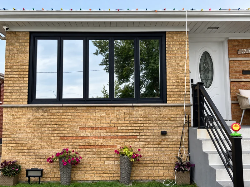 A Chicago brick home whose front windows Beast Auto Tints tinted