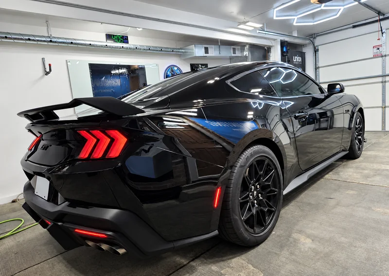 A black Ford Mustang tinted by Beast Auto Tints
