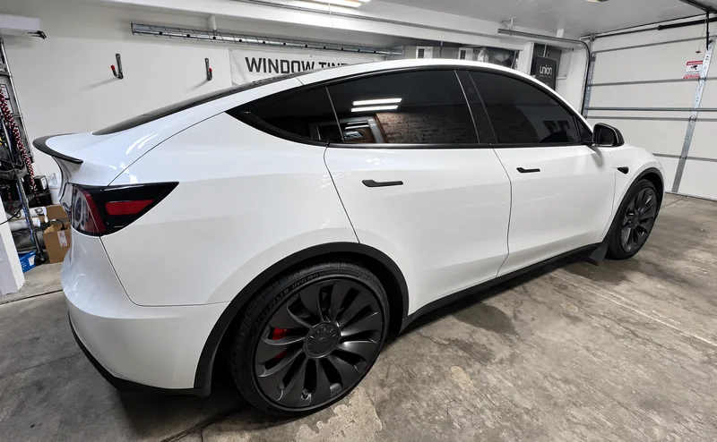 A white Tesla Model Y tinted by Beast Auto Tints