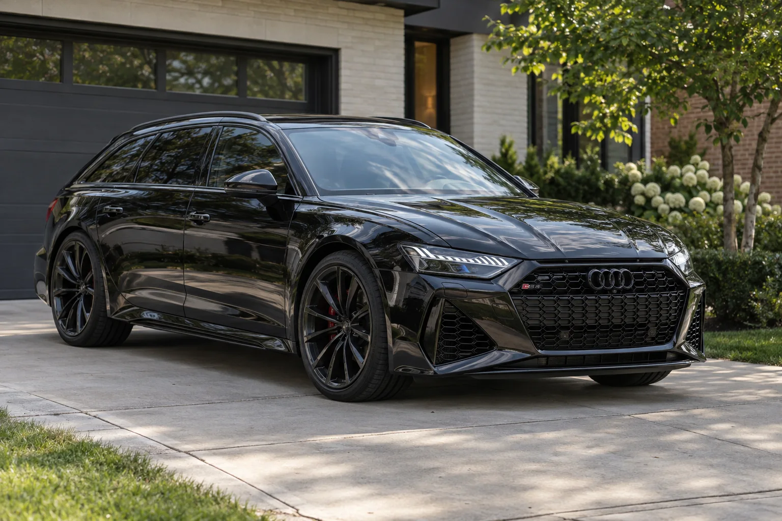Gloss black Audi RS6 Avant with tinted windows at Beast Auto Tints