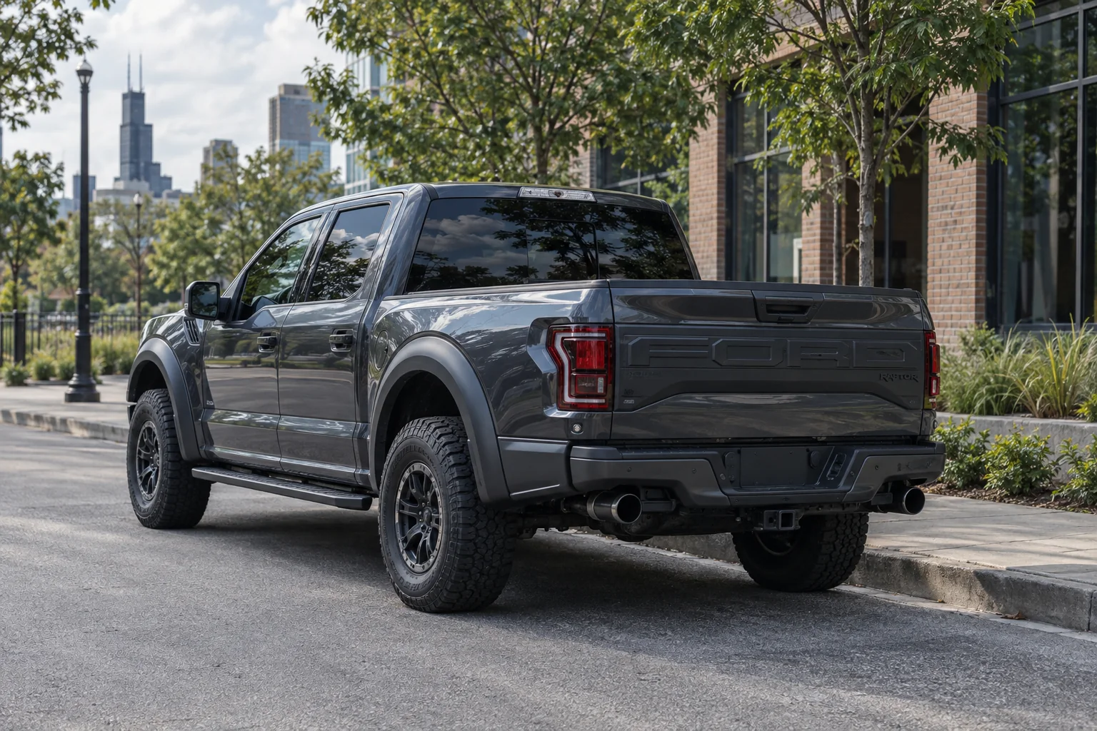 Graphite gray Ford F-150 Raptor with tinted windows at Beast Auto Tints
