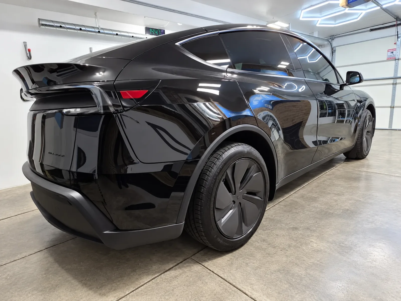 Black Tesla Model Y with tinted windows, tinted by Beast Auto Tints
